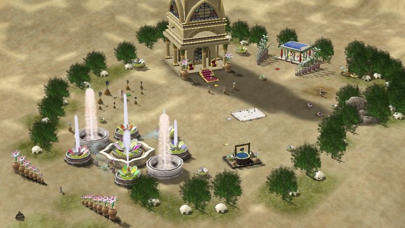 An oasis in the desert as viewed from above, with fountains and a well.