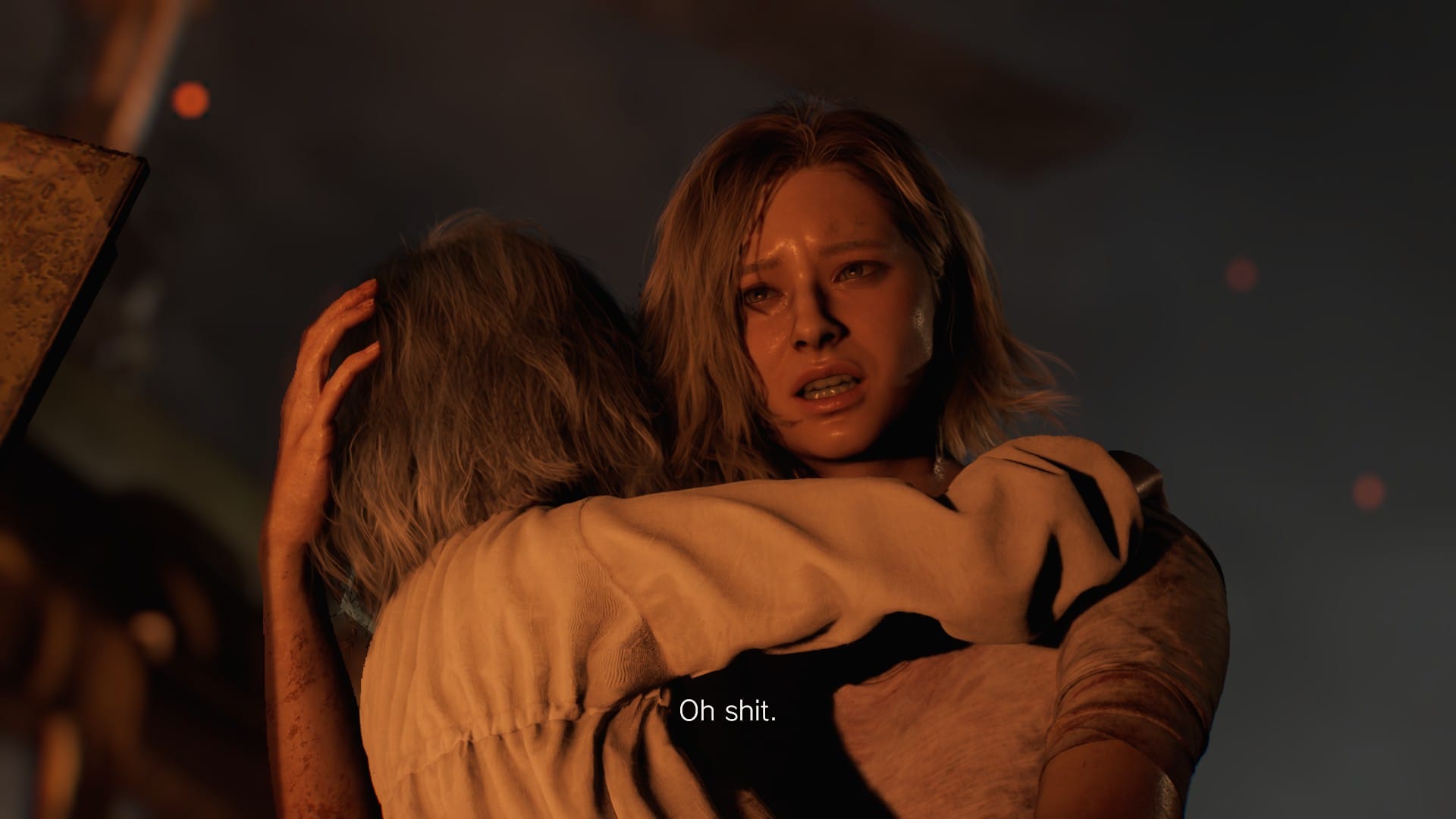 Grace from Resident Evil Requiem cradles Emily in the glow of a fire with a pained expression.