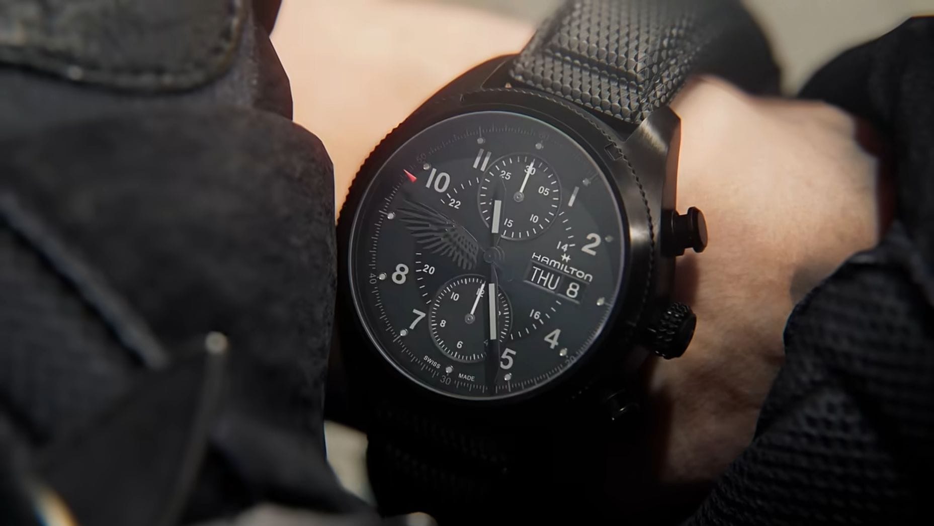A close-up of Leon's wristwatch, an expensive Hamilton.
