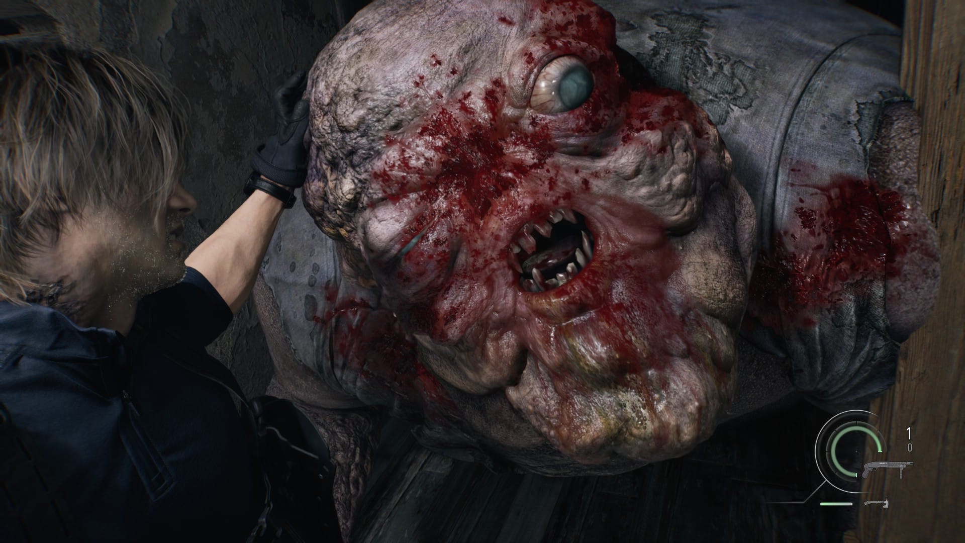Leon fights off a monster with a bloodied face and double chin.