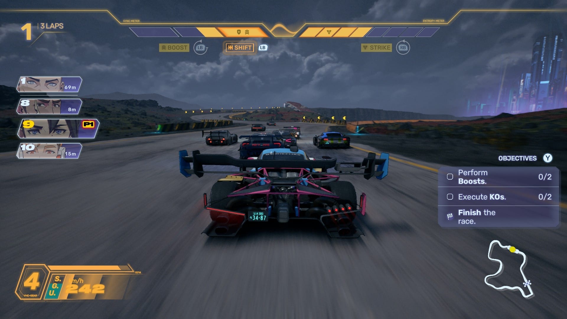 A car with a huge spoiler driving on a grey track in a cloudy day. A brightly lit city can be seen on the horizon to the right.