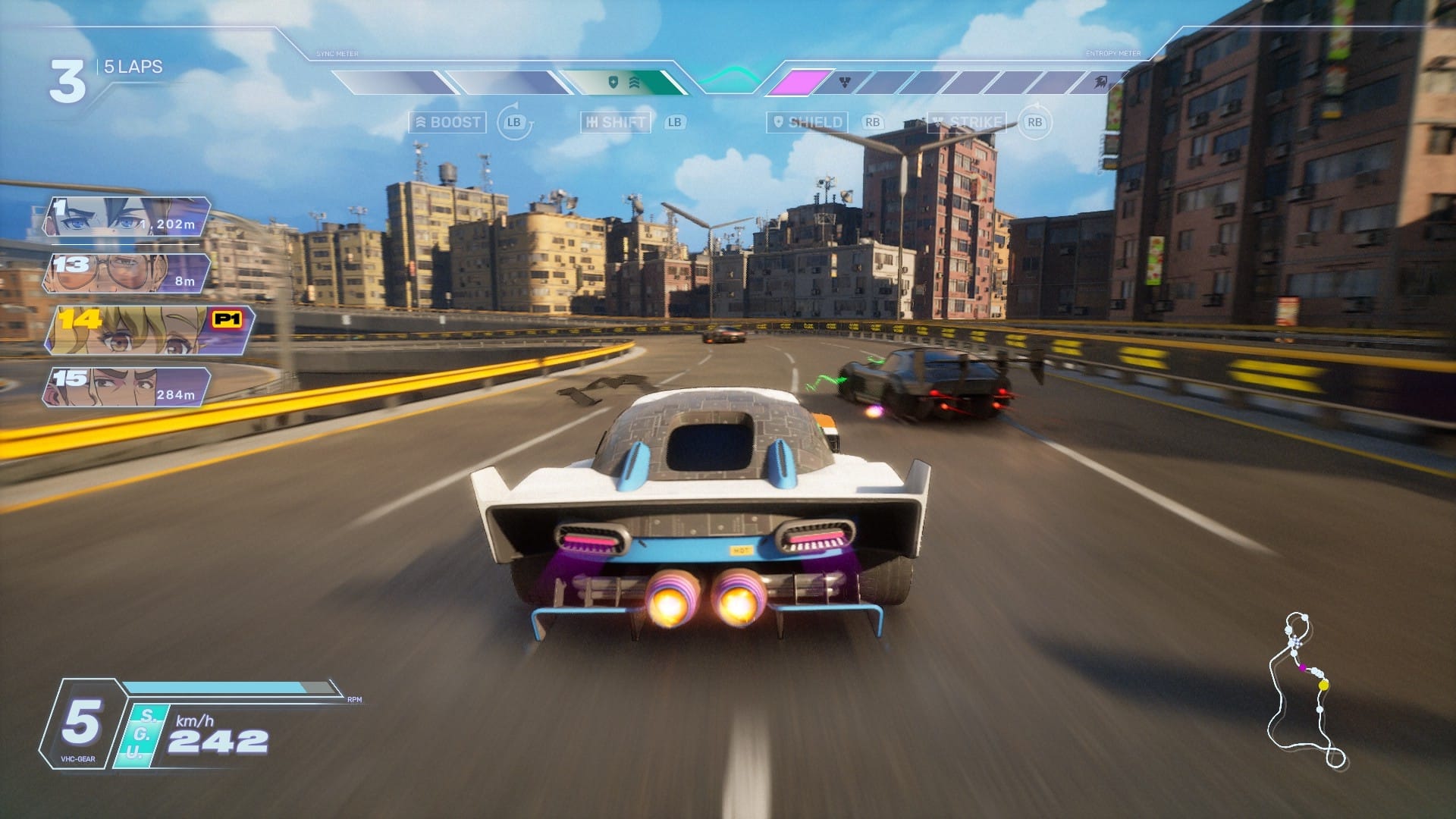 A raised highway racetrack through a city of tall buildings under blue skies. Three cars are visible on the track.