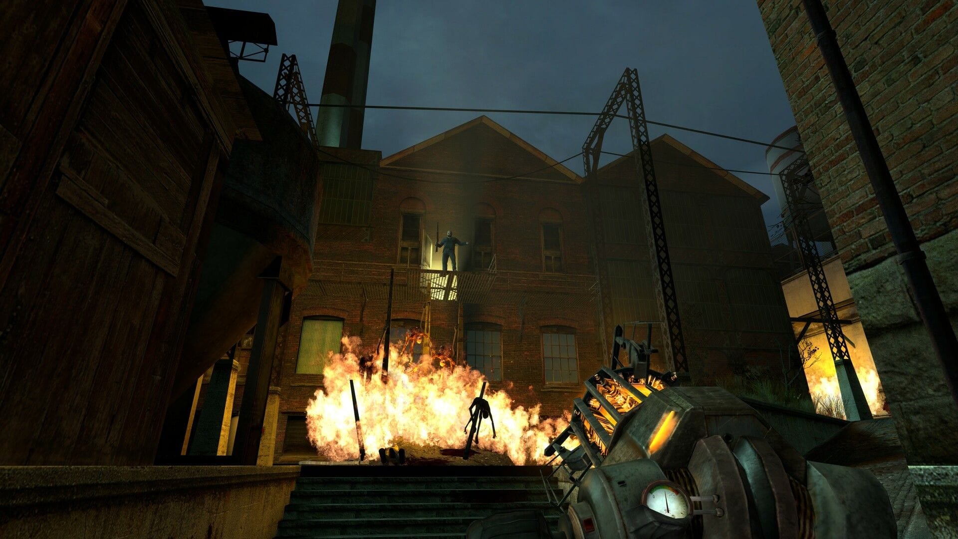 The player observes a figure on a fire escape far above, with flames below the figure.