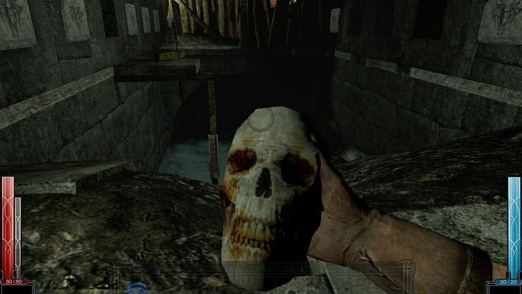 The player holds a skull in a glum dungeon.