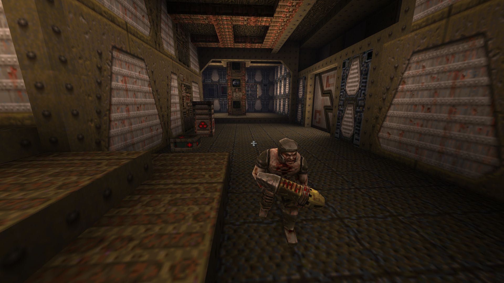 A soldier patrols a brown corridor in Quake.