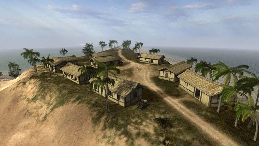 Several houses sit on a small rise on a Pacific island.