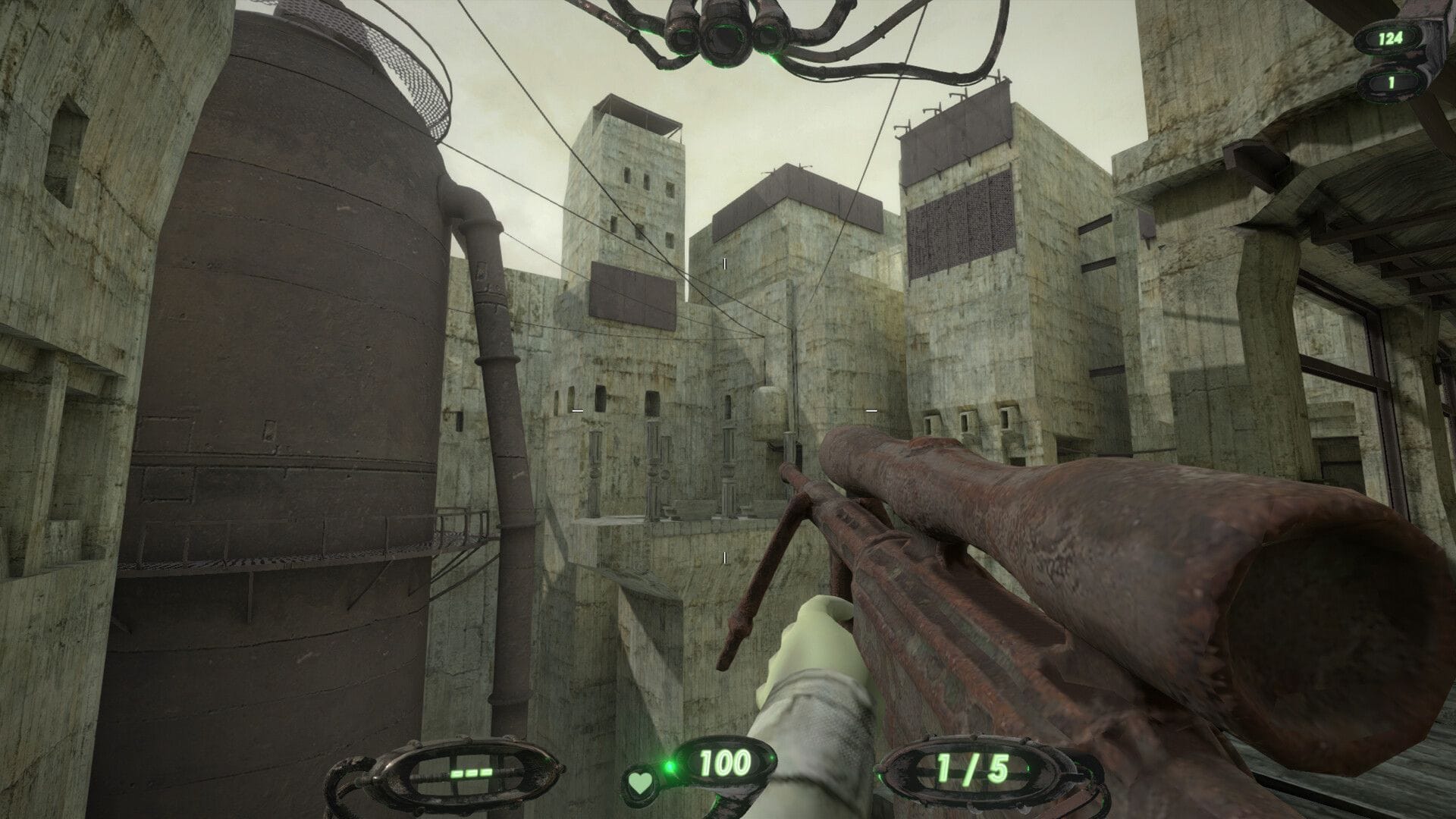 The player points a sniper rifle at the grey buildings ahead of them.