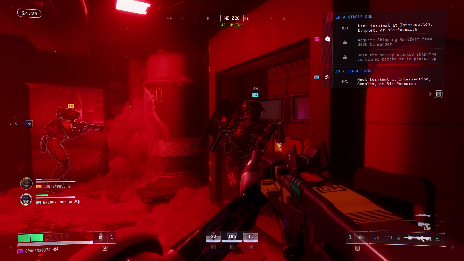 Three players in a corridor under intense red lighting.
