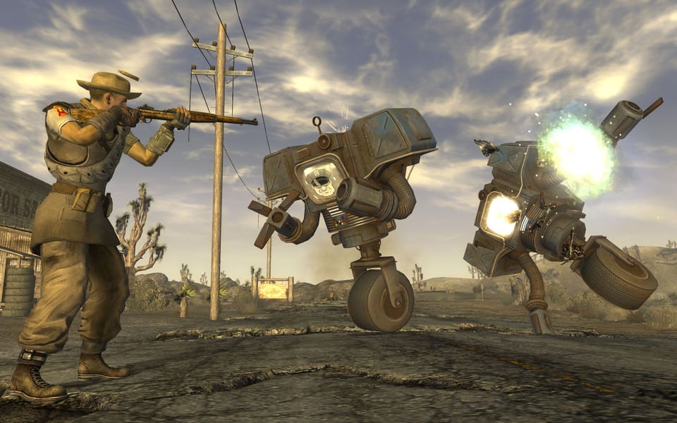 A soldier fires his rifle at two robots in Fallout: New Vegas, destroying one of the machine GOOD WORK.