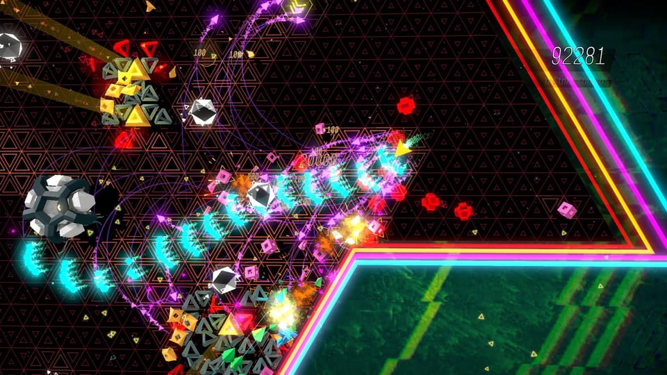A neon battlefield viewed from above as geometric shapes are torn apart by laser fire.