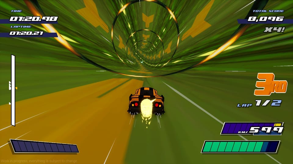 A little orange car drives through a round, green tunnel.