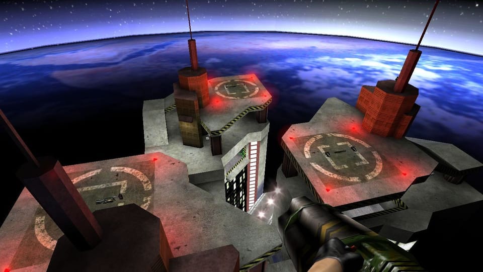 The player floats above three landing pads in orbit around earth.