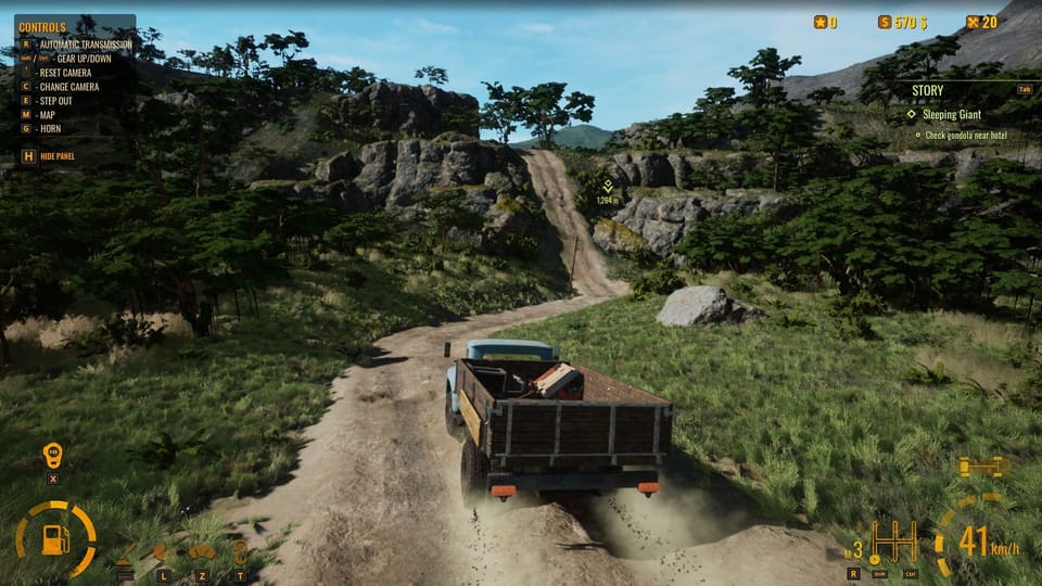 A big truck careens over a dirt road in an unspecified South American country.